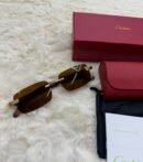Cartier Zonnebril Bruine Glazen, Goude Houten Montuur